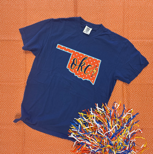 OKC SPIRIT 2025: Oklahoma State Shape "OKC" Script (COMFORT COLORS SHORTSLEEVE)